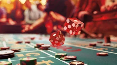 Dice being rolled on a craps table, featured on Ameristar Council Bluffs’ website.