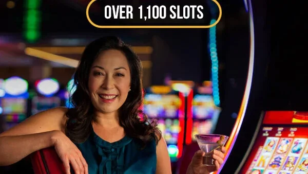 A woman surrounded by slot machines on the Lucky Eagle casino floor.